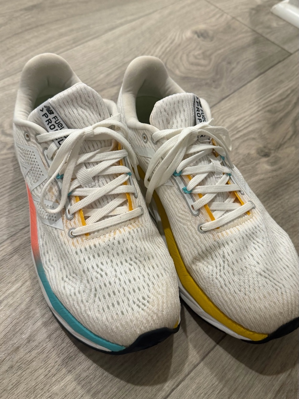 New Balance Women’s White Athletic Shoes with Yellow and Teal Accents